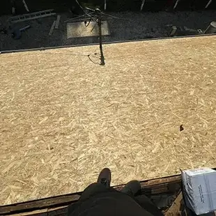 New wooden sheathing installed on roof