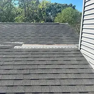 Roof with damaged shingles
